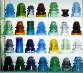 Close-Up Shot of Display of Colorful Glass Insulators in Different Shapes and Sizes