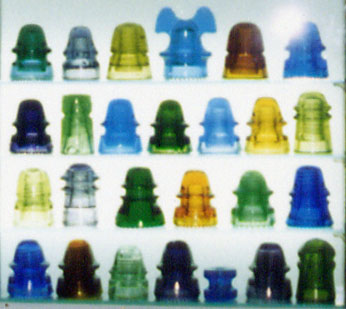 Close-Up Shot of Display of Colorful Glass Insulators in Different CDs