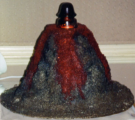 Display of Oxblood Red Glass Insulator on Top of Volcano